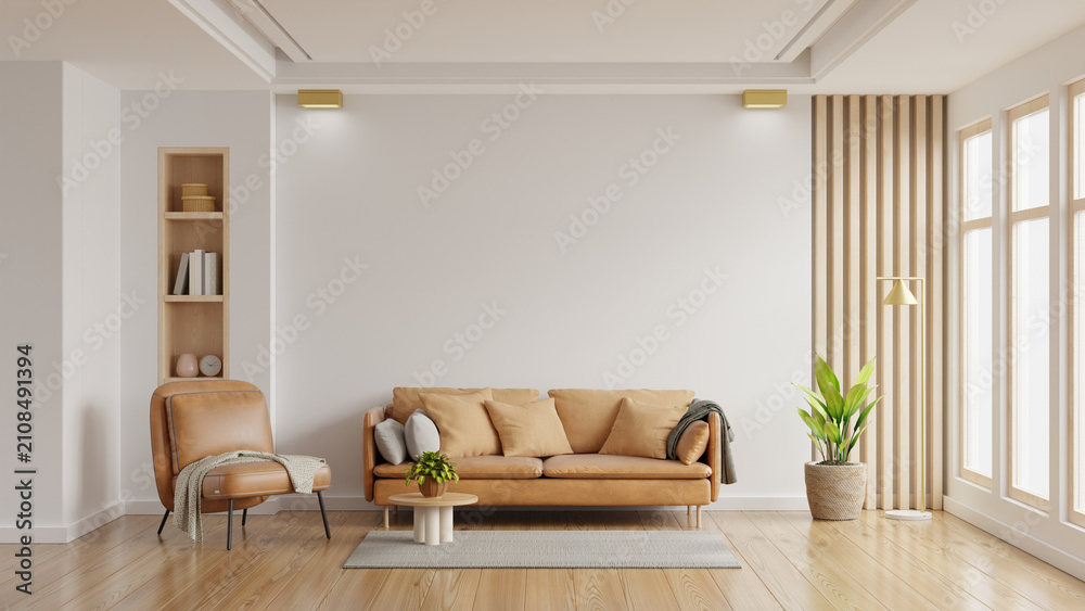 Fototapeta premium Living room wall mockup in bright tones with leather sofa and leather armchair.