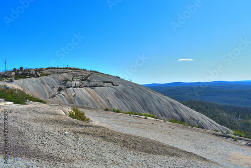 Bald Rock is the largest granite monolith in Australia. It stands at 200 meters high, 750 meters long, and 500 meters wide. granite on top