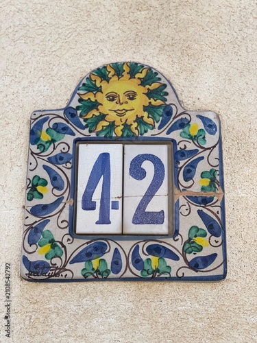 Hand painted ceramic tiles that say number 42