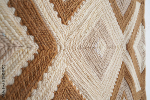 Diamond pattern woven tapestry with thick yarn in brown and cream shades