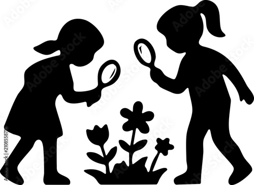 Children Examining Flowers With Magnifying Glasses Outdoors