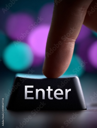 Fingers ready above enter key with bright colors