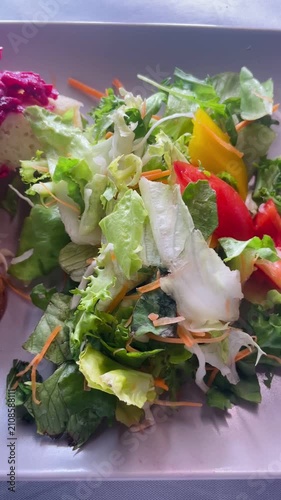 Vertical close up of a healthy breakfast with fresh vegetables. Nutritious food arrangement promoting balanced diet and natural eating habits.