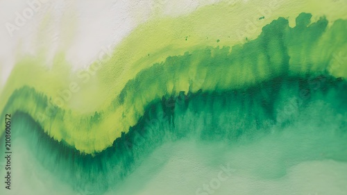 Abstract watercolor painting with flowing gradients of lime green and emerald, artistic textured background with soft color transitions