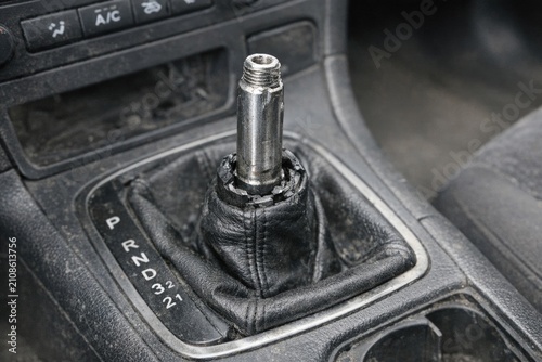 A close-up shot of a car's gear shift knob