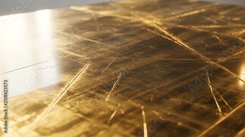 Closeup of a scratched golden metallic surface with reflective light, luxury brushed gold texture with deep scratches and worn finish