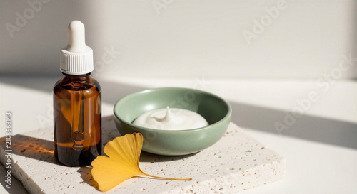Natural autumn skincare products with a ginkgo leaf, presented cleanly on a white background 