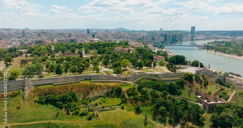 Detailed 4K drone panorama focusing on the stone walls of Belgrade Fortress in central Belgrade, Serbia, overlooking the Danube and Sava rivers on a sunny summer day ahead of Expo 2027.