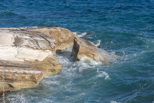 Waves Crashing Against White Limestone Cliffs on a Rocky Mediterranean Coastline