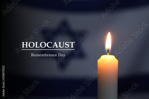 Bild auf Leinwand Holocaust Remembrance Day. Burning candle against flag of Israel