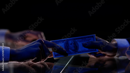 An illegal businessman is captured by the police and tries to pay a bribe