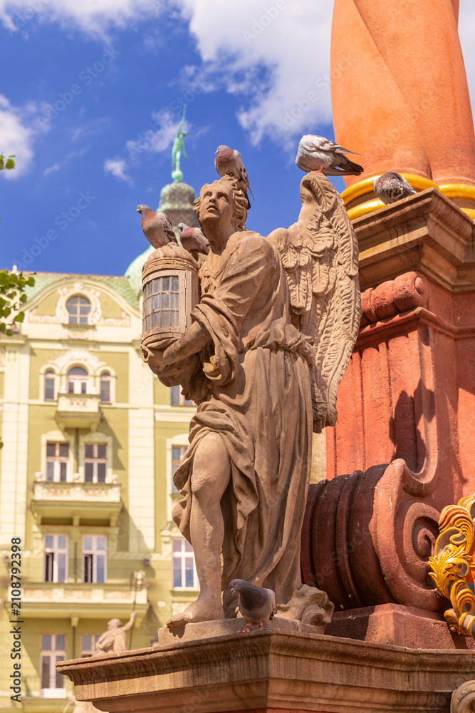 Obraz premium Baroque angel statue on Market Square fountain in Swidnica, Lower Silesia, Poland