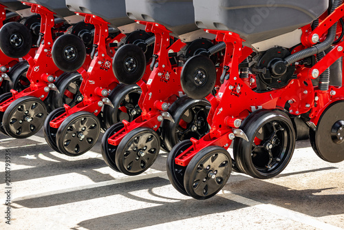 Fotografie Agricultural seeding machinery planter press wheels close up