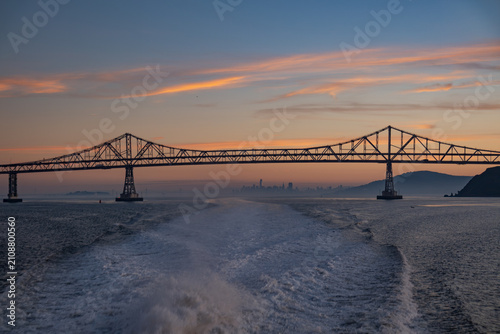 Sunset view of Richmond Bridge with distant San Francisco skyline