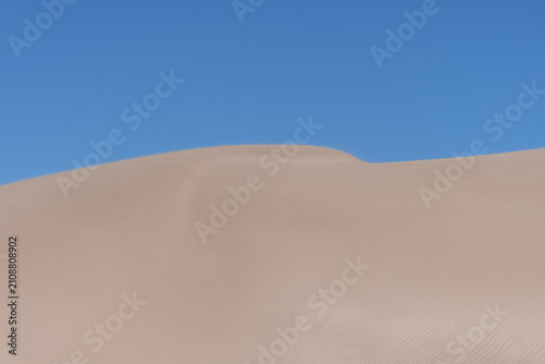 A barren landscape of a sand dune.