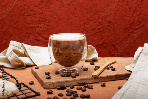 Cookies and a cup of coffee with milk on a table.