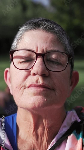 Yoga, Senior woman enjoy meditation relax training in nature park - Wellness, healthy life style and anti-stress practice - Vertical video