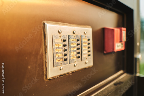 Foto Weathered apartment buzzer panel with handwritten numbers