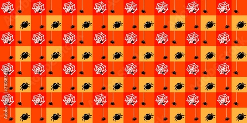 Fotografija Orange and red chequerboard grid with a small black spider and cobweb pattern overlay