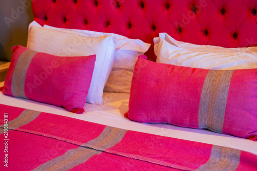 Canvastavla Vibrant pink tufted headboard and bedding, Comfortable Family Bed for Restful Ni