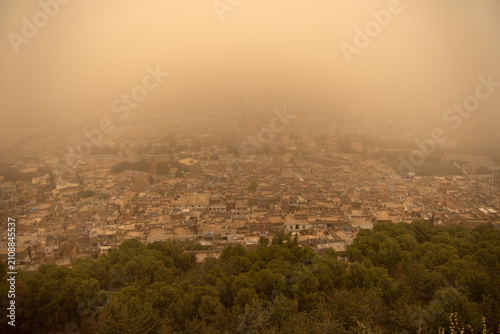 Aerial Panorama of Dense Tlemcen Cityscape Swallowed by Extreme Orange Dust Storm Haze