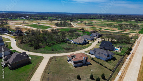 Bild auf Leinwand Freshly paved streets service newly built homes within Dallas suburb Terracina subdivision