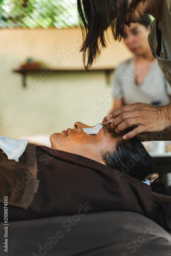 Fotografía Woman receiving facial treatment in a relaxing spa