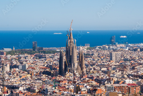 Elevated View of Barcelona City With Famous Sagrada Familia Church and Mediterranean Sea in the Horizon