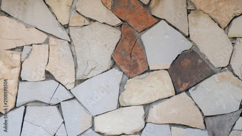 Canvastavla Close-up of irregular multicolored flagstone masonry wall texture