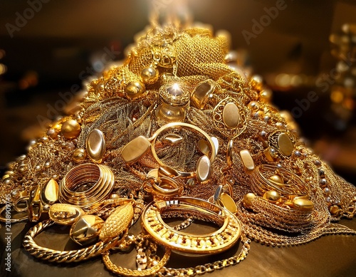 a pile of luxurious gold jewelry gold jewelry pile valuable wealth luxury shiny accessories necklaces bracelets