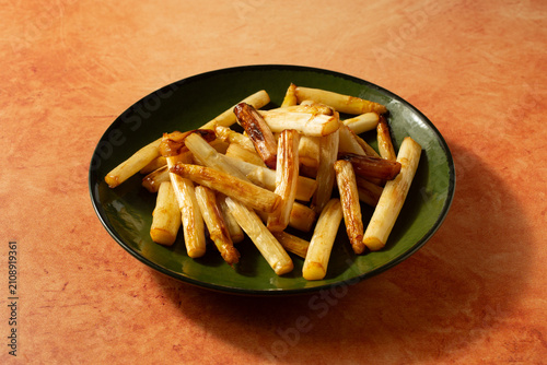 Quadro su tela A view of a plate of sauteed white asparagus.