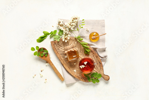 Jar of sweet honey with aca...