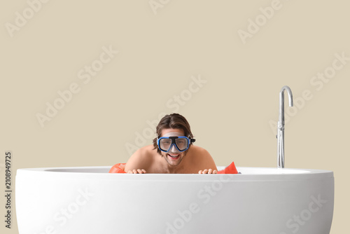 Male tourist with snorkelin...