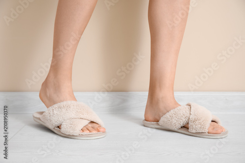 Womans legs in soft slipper...