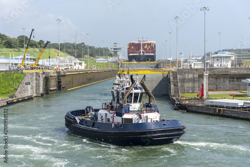 Photography Harbor tug supporting vessel transit inside the Agua Clara Locks