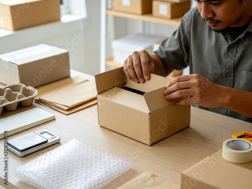 man packing boxes
