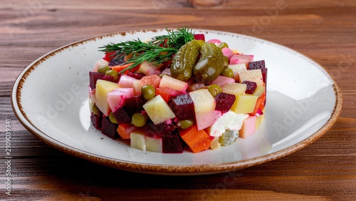 Traditional russian vinegret salad with beetroot and pickles