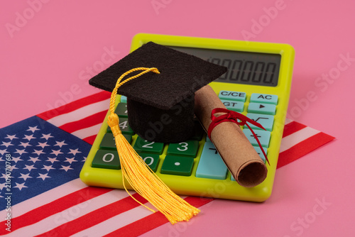 Photography Academic cap, calculator, and scroll against the background of the US flag