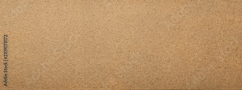 Warm tan recycled kraft paper texture with subtle fibers and clean full-frame surface