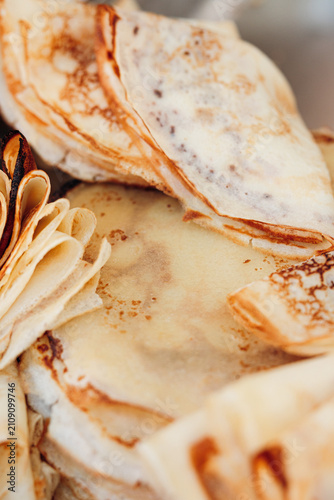 фотографія Close up of delicious traditional thin crepes and folded pancakes