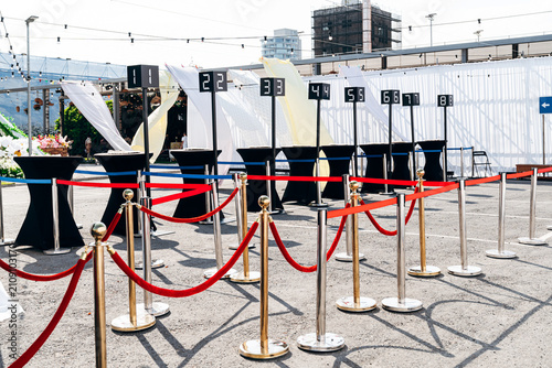 Outdoor registration desks with numbers for event entrance