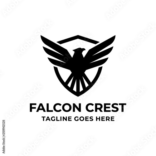 Bold heraldic crest featuring a stylized bird of prey with wings spread across a protective shield.