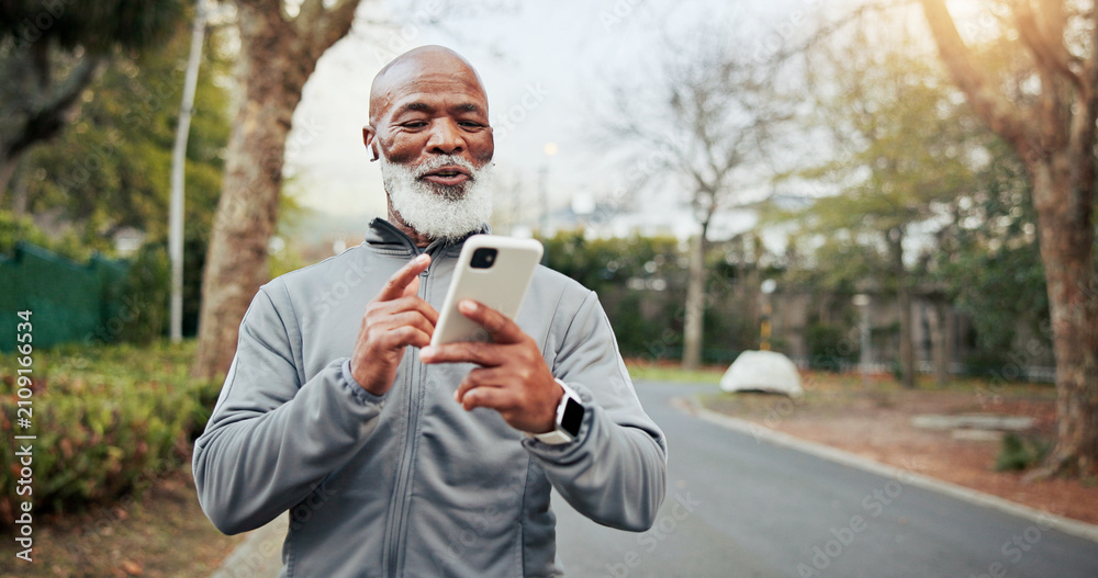 Fototapeta premium Fitness, phone and senior man with music outdoor for wellness playlist, podcast and smile. Mobile, happy runner and black person with earphones for exercise audio, space and active retirement