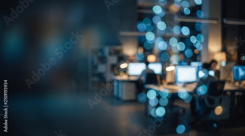 Abstract blue bokeh office background with computers and lights, technology workplace night atmosphere and copy space