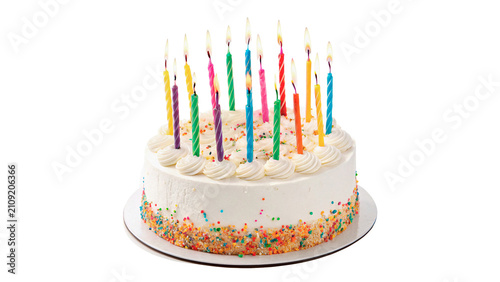 Large delicious birthday cake decorated with colorful burning candles isolated on transparent background cut out