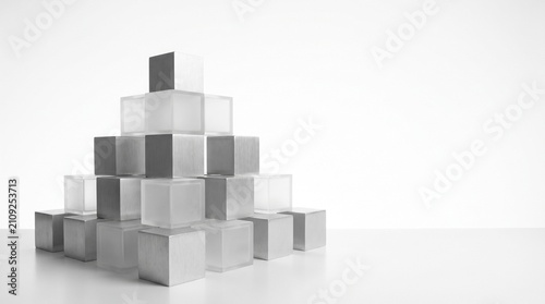Stack of frosted and brushed metal cubes forming a pyramid against a clean white background with arranged white surface soft lighting made cubes
