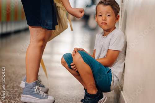 Cuadro en lienzo Young boy experiencing bullying and intimidation at school