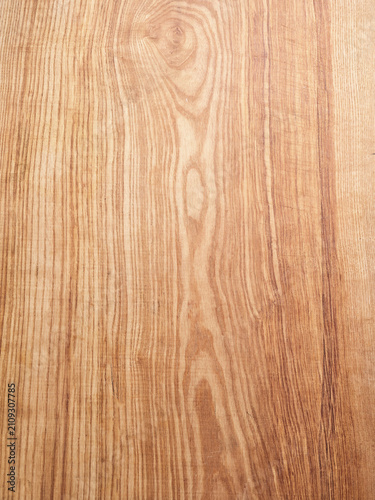 Natural ash wood surface with grain patterns, perfect for showcasing food styling or menu backgrounds