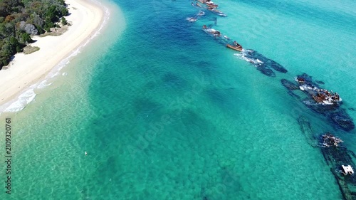Top down view of submerged wreck in turquoise ocean