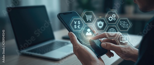 Individual engaging with a smartphone to explore digital financial solutions featuring a cutting edge interface alongside a laptop in a contemporary office environment